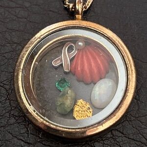 Gold-tone Pendant with charms inside and 28” chain